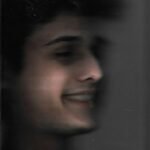 a blurry photo of a man smiling